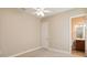 Carpeted bedroom with neutral walls, ceiling fan, and ensuite bathroom access at 207 Spalding Way, Deland, FL 32724