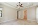 Bedroom featuring a ceiling fan and tray ceiling at 207 Spalding Way, Deland, FL 32724