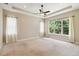 Large bedroom with a ceiling fan and large windows at 207 Spalding Way, Deland, FL 32724