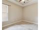 Bedroom with a ceiling fan, neutral colors, and carpet flooring at 207 Spalding Way, Deland, FL 32724