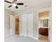 Bedroom with closet and view into bathroom area at 207 Spalding Way, Deland, FL 32724