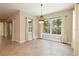 Dining room features an elegant chandelier, large windows, and neutral wall colors at 207 Spalding Way, Deland, FL 32724