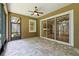 Screened patio with brick flooring and view of landscaped backyard and kitchen at 207 Spalding Way, Deland, FL 32724