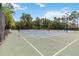 Well-maintained community tennis courts ready for recreational play, surrounded by lush greenery at 207 Spalding Way, Deland, FL 32724