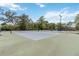 Well-maintained community tennis courts ready for recreational play, surrounded by lush greenery at 207 Spalding Way, Deland, FL 32724