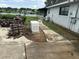 Backyard featuring a partial lake view, generator and walkway at 23717 Milford Dr, Eustis, FL 32736