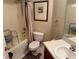 Well-lit bathroom featuring a shower-tub combo and accessible features at 23717 Milford Dr, Eustis, FL 32736