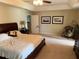 Spacious bedroom featuring a tray ceiling, carpet flooring, and neutral paint at 23717 Milford Dr, Eustis, FL 32736