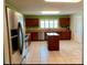 Bright, spacious kitchen with stainless steel appliances, an island, and ample cabinet space, ideal for cooking at 23717 Milford Dr, Eustis, FL 32736