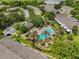 Aerial view of the community showcasing the beautiful pool area with palm trees and manicured landscaping at 2420 Stockton Dr, Sanford, FL 32771