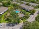 A scenic aerial view of the community pool area surrounded by lush landscaping and residences at 2420 Stockton Dr, Sanford, FL 32771