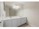 Bright bathroom featuring a large mirror, double sinks, and lots of cabinet space at 2420 Stockton Dr, Sanford, FL 32771