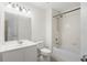 A well-lit bathroom with a shower and tub combo, and a vanity with a sink and a large mirror at 2420 Stockton Dr, Sanford, FL 32771