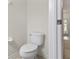 Simple bathroom with toilet and door leading to the hallway at 2420 Stockton Dr, Sanford, FL 32771
