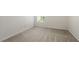 Neutral carpeted bedroom has a window providing ample natural light at 2420 Stockton Dr, Sanford, FL 32771