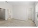 Spacious bedroom featuring neutral carpet and direct access to walk-in closet and bathroom at 2420 Stockton Dr, Sanford, FL 32771