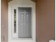 Stylish front door with sidelight, offering a secure and welcoming entrance at 2420 Stockton Dr, Sanford, FL 32771