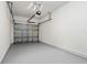 Spacious garage featuring a sealed floor and an automatic door opener system at 2420 Stockton Dr, Sanford, FL 32771