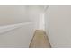 Neutral carpeted hallway with access to additional rooms in the home at 2420 Stockton Dr, Sanford, FL 32771