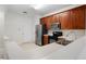 Well-lit kitchen equipped with stainless steel appliances and abundant counter space at 2420 Stockton Dr, Sanford, FL 32771