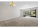 Bright living room with a chandelier and view of screened lanai at 2420 Stockton Dr, Sanford, FL 32771