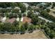 Aerial view of several homes surrounded by many trees with a view of the community at 2426 Breezy Meadow Rd, Apopka, FL 32712