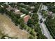 Overhead view of a home and its neighborhood, with many trees and manicured lawns at 2426 Breezy Meadow Rd, Apopka, FL 32712