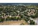 Aerial view of the neighborhood homes surrounded by mature trees at 2426 Breezy Meadow Rd, Apopka, FL 32712
