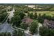 Aerial view of a home with a large lawn and tall trees at 2426 Breezy Meadow Rd, Apopka, FL 32712