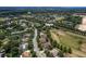An aerial shot showcasing the neighborhood's landscape, featuring tree-lined streets and well-maintained homes at 2426 Breezy Meadow Rd, Apopka, FL 32712