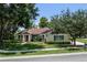 Inviting single-story home featuring well-maintained landscaping, a classic design, and charming curb appeal at 2426 Breezy Meadow Rd, Apopka, FL 32712