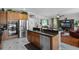 Gourmet kitchen featuring granite countertops, stainless steel appliances, and an open layout at 2426 Breezy Meadow Rd, Apopka, FL 32712