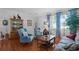 Welcoming living room featuring hardwood floors, comfortable seating, and natural light at 2426 Breezy Meadow Rd, Apopka, FL 32712
