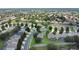 Expansive aerial view of a suburban neighborhood featuring well-maintained homes and lush green landscaping at 2669 Manesty Ln, Kissimmee, FL 34747