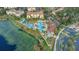 Aerial view showcasing community pool, clubhouse, playground and picturesque surroundings at 2669 Manesty Ln, Kissimmee, FL 34747