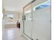 Bright bathroom featuring a glass enclosed shower, soaking tub, and lots of natural light at 2669 Manesty Ln, Kissimmee, FL 34747