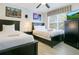 Bedroom with two twin beds, 'Star Wars' themed decor, and a window with blinds at 2669 Manesty Ln, Kissimmee, FL 34747