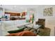 Bright open-plan living area with modern furnishings and a seamless flow to the kitchen at 2669 Manesty Ln, Kissimmee, FL 34747