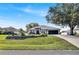 Charming single-story home with a well-manicured lawn and mature trees in a quiet residential neighborhood at 2919 Foraker Way, Kissimmee, FL 34758