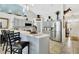 Bright kitchen with stainless steel appliances, gray cabinets, a breakfast bar, and an open layout at 2919 Foraker Way, Kissimmee, FL 34758