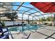 Inviting screened-in pool featuring a fountain, poolside decor, and ample seating area at 2919 Foraker Way, Kissimmee, FL 34758