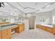 Large bathroom featuring a soaking tub, walk-in shower, double vanity, and ample counter space at 307 Running Wind Ln, Maitland, FL 32751