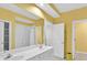 Bright bathroom with a double sink vanity and a shower behind a curtain at 307 Running Wind Ln, Maitland, FL 32751