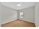 Bedroom with tan carpet, a window, and fresh paint at 307 Running Wind Ln, Maitland, FL 32751