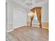 Staged dining room with a chandelier, decorative wall paneling, and wood-look tile floors at 307 Running Wind Ln, Maitland, FL 32751