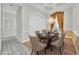 Elegant dining room features decorative chandelier, tray ceilings, and space for six at 307 Running Wind Ln, Maitland, FL 32751