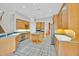 Spacious kitchen with an island, stainless appliances, and tile flooring at 307 Running Wind Ln, Maitland, FL 32751
