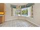 Bright kitchen nook with a view of the screened lanai and pool at 307 Running Wind Ln, Maitland, FL 32751