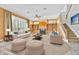 Spacious living room features a fireplace, built-ins, and large windows with plantation shutters at 307 Running Wind Ln, Maitland, FL 32751