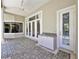 Covered patio with brick flooring, built in sink and access to the pool area at 307 Running Wind Ln, Maitland, FL 32751